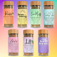 Load image into Gallery viewer, Set of seven glass jars with wooden lids, each labeled with a different blend name and URBLL branding.