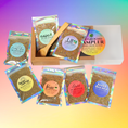Load image into Gallery viewer, Collection of herbal mood blends in packaging with colorful labels on a gradient background