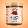 Load image into Gallery viewer, Jar of Reishi mushroom powder with a wooden lid on an orange background