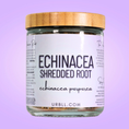 Load image into Gallery viewer, Jar of Echinacea Shredded Root with a wooden lid on a purple background