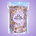 Load image into Gallery viewer, Packaged Egyptian Blue Lotus flowers with a holographic bag on a purple background
