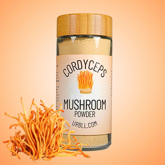 Jar of cordyceps mushroom powder with a label on an orange background