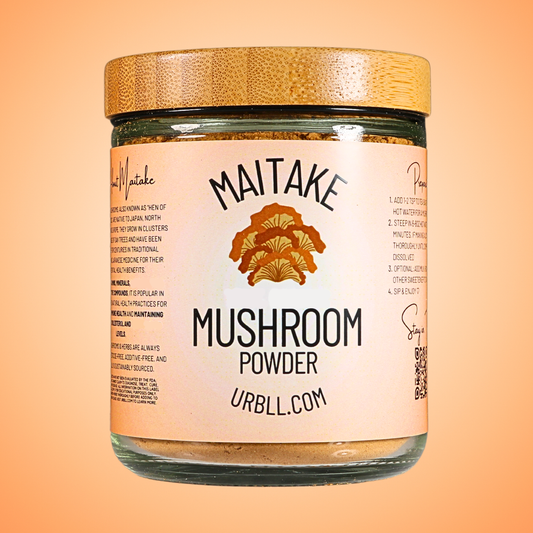 Jar of Maitake mushroom powder with a wooden lid on an orange background