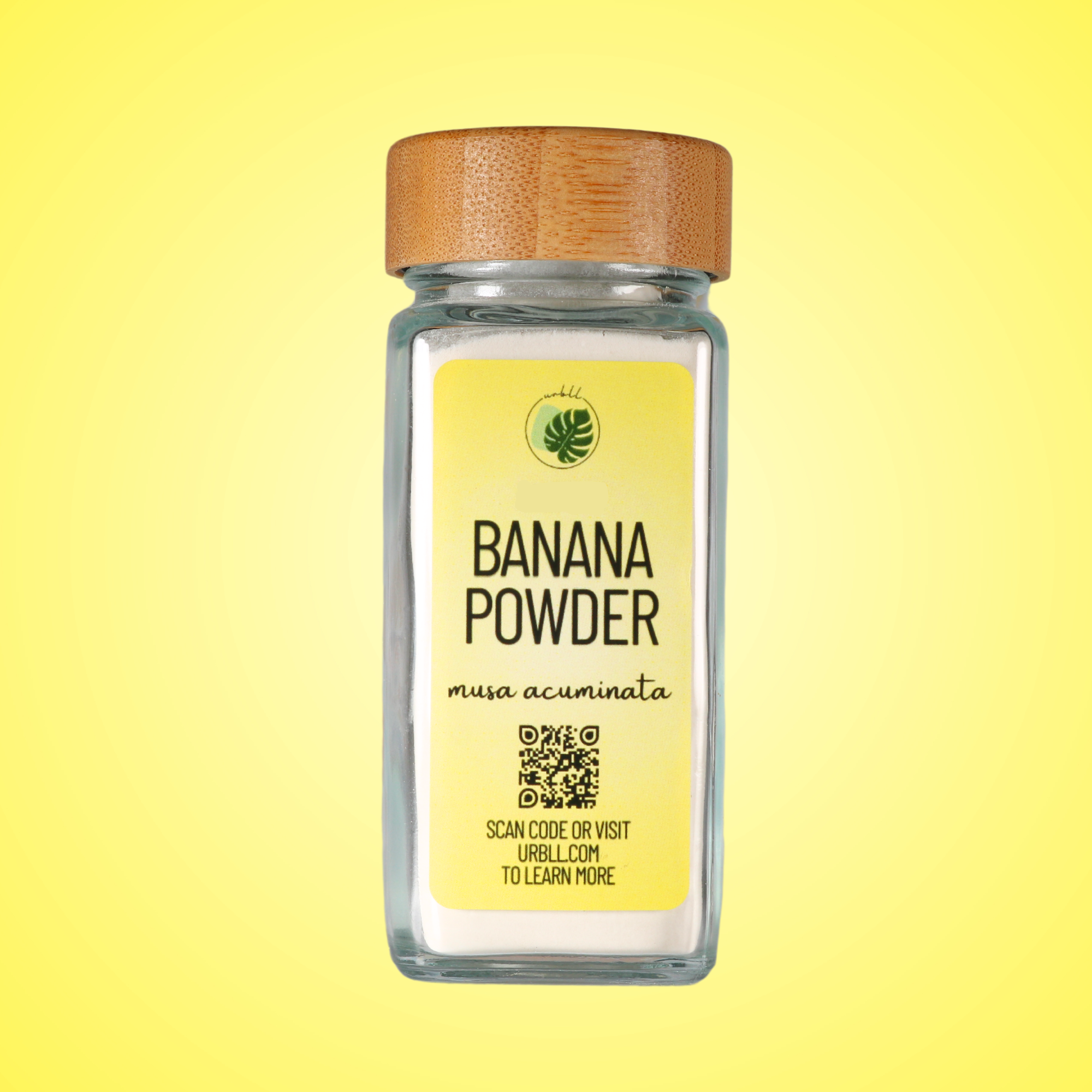 Jar of banana powder with a wooden lid on a yellow background