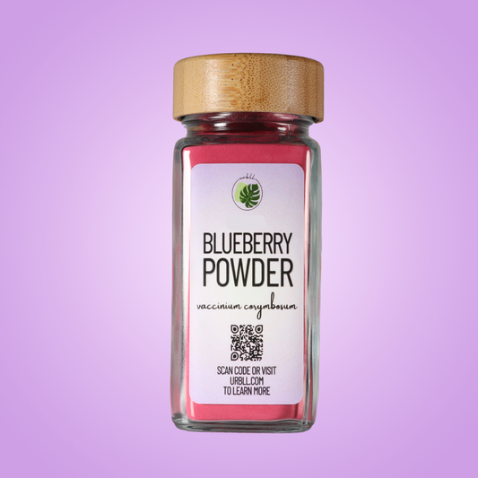 Jar of blueberry powder with a wooden lid on a purple background