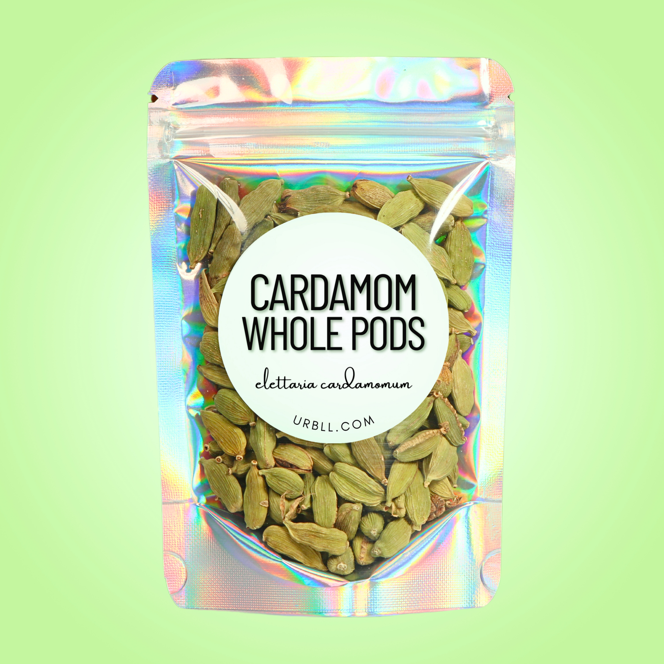 Packaged cardamom whole pods with a colorful label on a green background