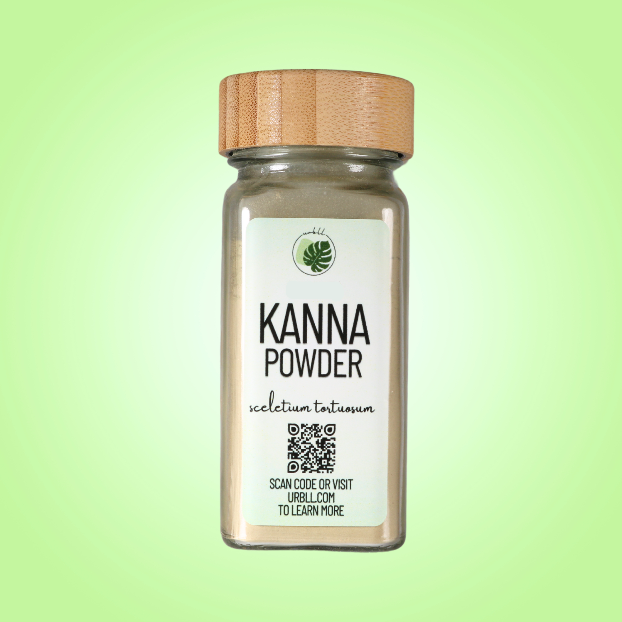 Jar of Kanna powder with a wooden lid on a green background