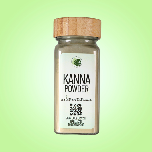 Jar of Kanna powder with a wooden lid on a green background