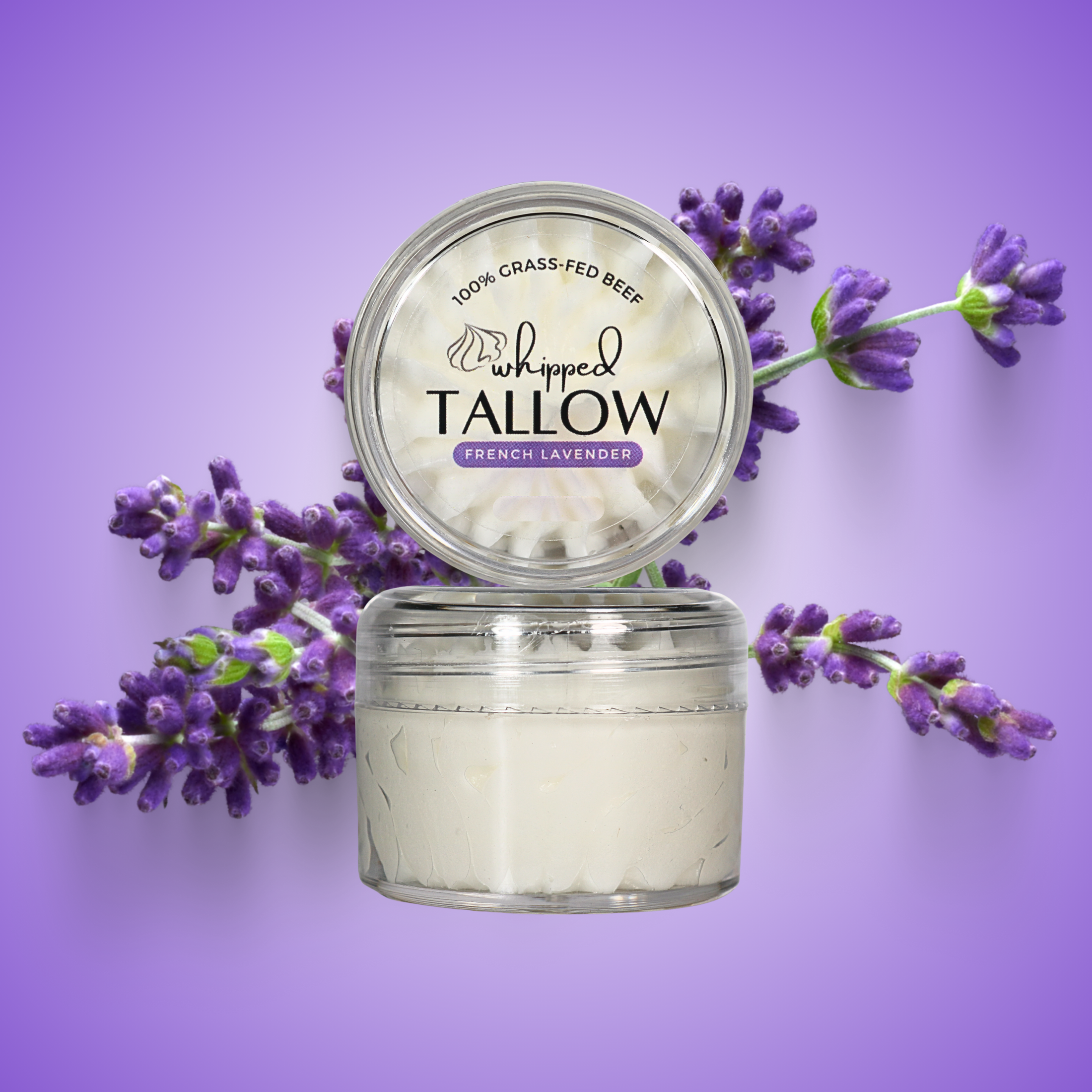 Jar of 'Whipped Tallow' with lavender flowers on a purple background